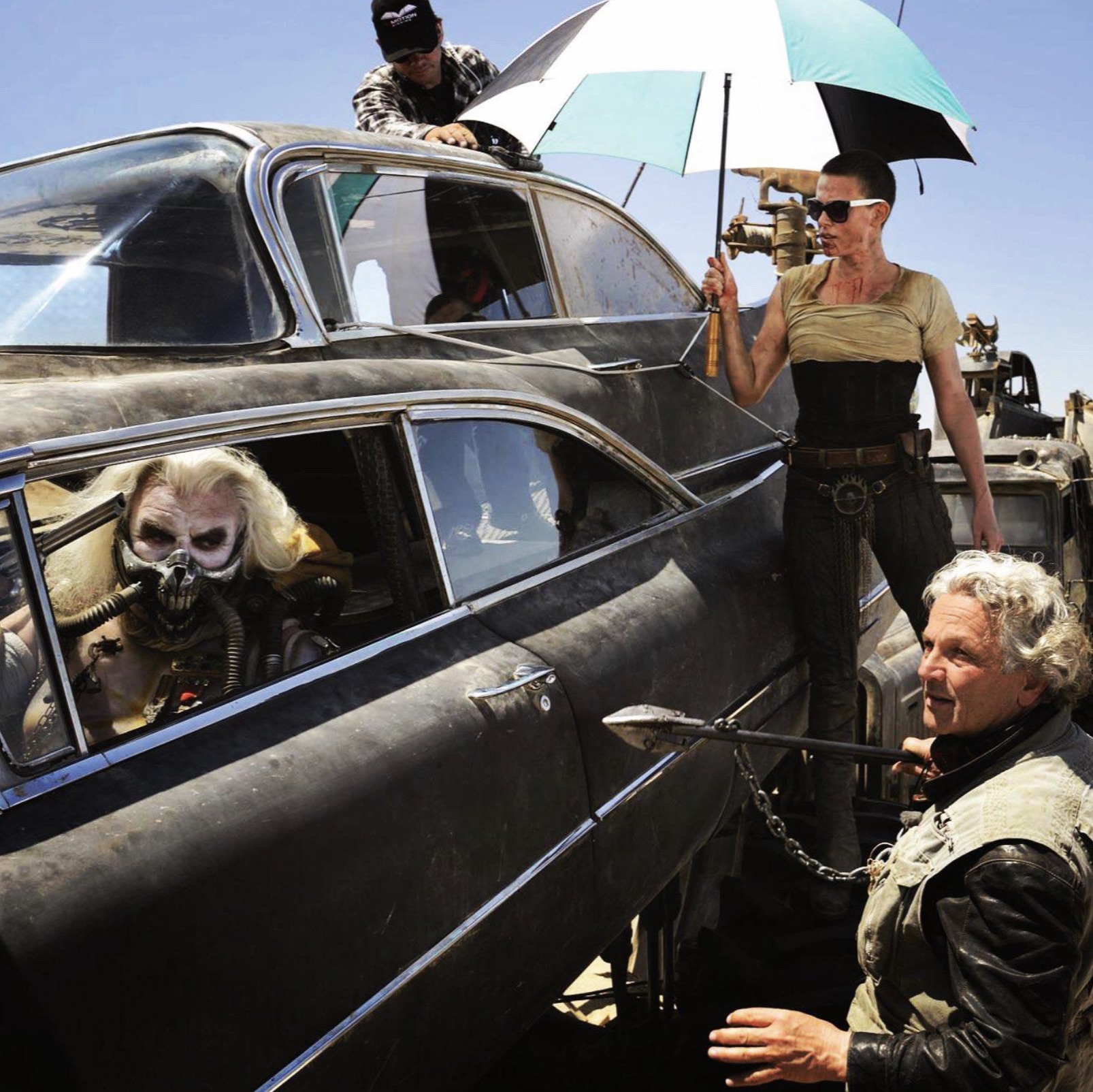 Hugh Keays-Byrne, Charlize Theron, and George Miller on set. Mad Max: Fury Road, 2015 